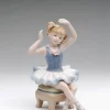Porcelain Ballerina in Blue Dress Siting on Chair Figurine